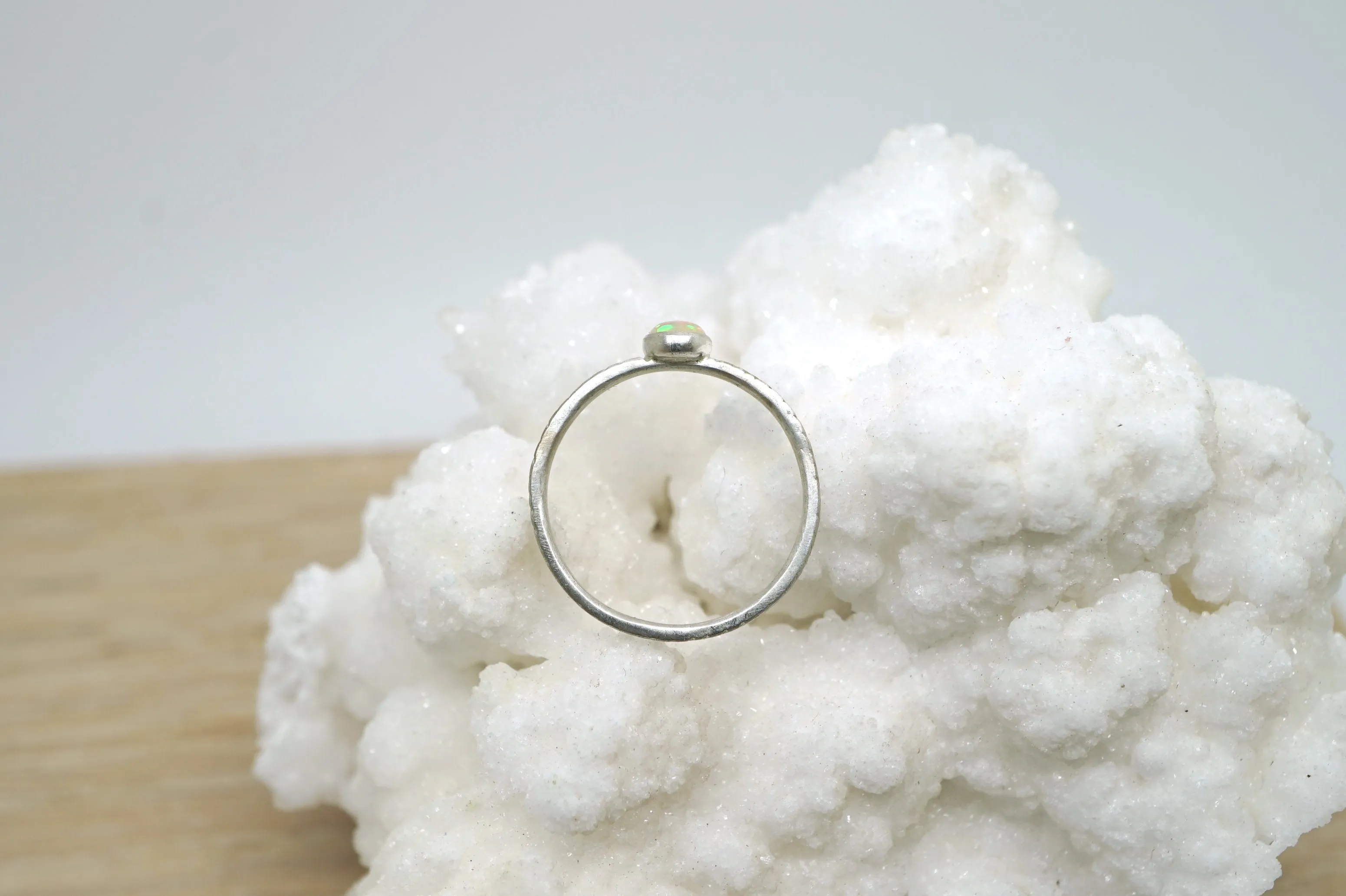 Opal ring with hand-carved feather textures